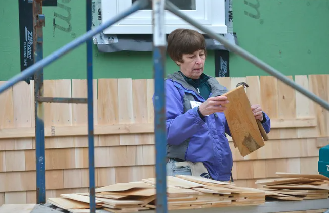 Cape Cod Times Images by Merrily Cassidy, Images of Volunteer sorting shingles at Phoebe Way. 