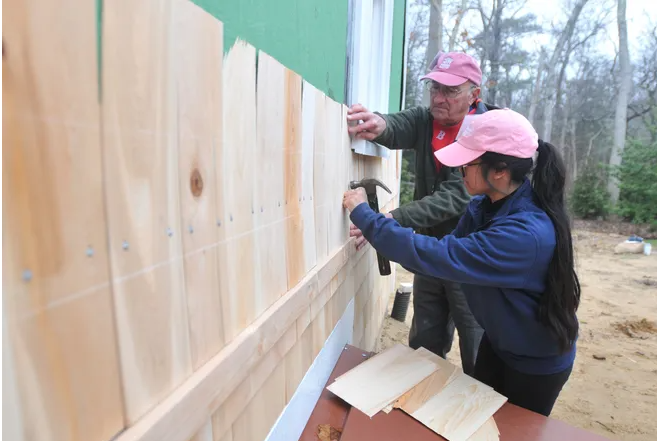 Cape Cod Times Images by Merrily Cassidy, Images of Volunteers and Homeowner shingling at Phoebe Way